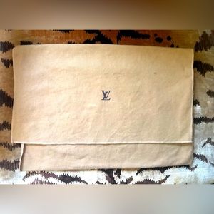 Little Louis Vuitton golden tan dust bag.